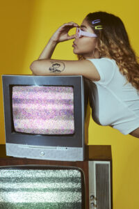 fashion style posing with tv
